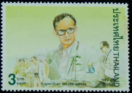 A stamp printed in Thailand shows portrait of Bhumibol Adulyadej Rama IX of Thailand ,Golden jubilee, circa 1996のeditorial素材