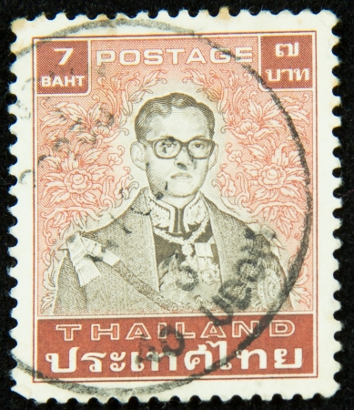 A stamp printed in Thailand shows portrait of Bhumibol Adulyadej Rama IX of Thailandのeditorial素材