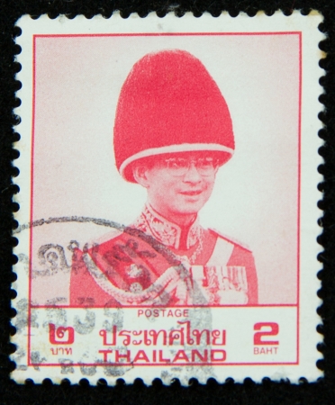 A stamp printed in Thailand shows portrait of Bhumibol Adulyadej Rama IX of Thailandのeditorial素材