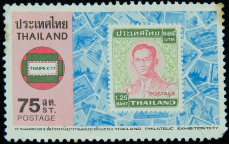 A stamp printed in Thailand shows portrait of Bhumibol Adulyadej Rama IX of Thailand (glasses)のeditorial素材