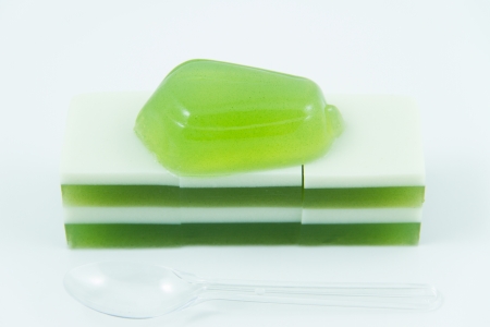 Cubes of Green tea jelly on a white backgroundの写真素材