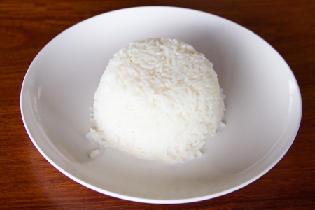 Cooked rice on white dishの写真素材