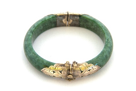 Old jade bracelet on white backgroundの写真素材