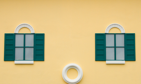 Window on the yellow wallの写真素材