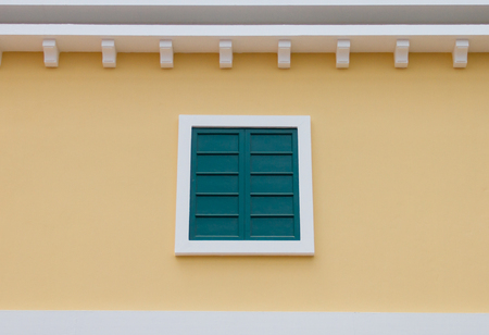 Green Window on yellow backgroundの写真素材