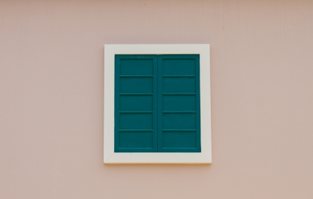 White window on a pink wallの写真素材