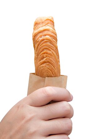 Puff pastry sticks in her handの写真素材