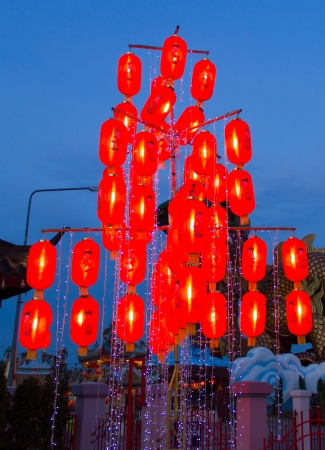 Chinese lamps on tree at  twilightの写真素材