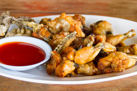 fried Frog Legs in dishの写真素材