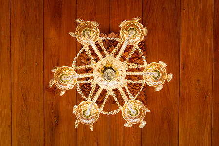 Crystal lamps hung on wooden panelsの写真素材