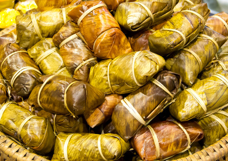 sticky rice covered in banana leafの写真素材