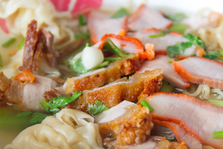 Crispy pork  in noodle bowlの写真素材