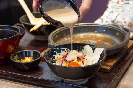 Salad and dressing in a cupの写真素材