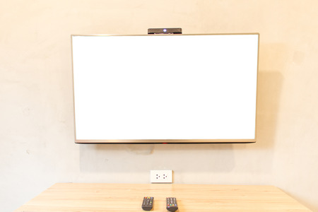Television hanging on the white wallの写真素材