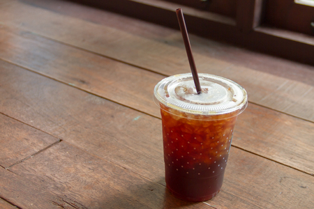 Americano iced coffee on wooden tableの写真素材