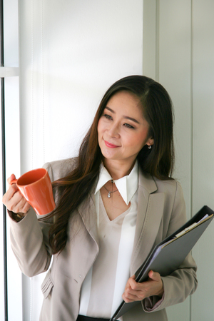 businesswoman with a cup of coffeeの写真素材