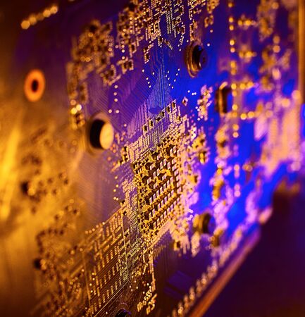 Electronics in blue-yellow light. Microelectronics in neon light.