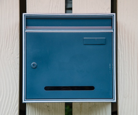 mail box with locked  in front of houseの写真素材