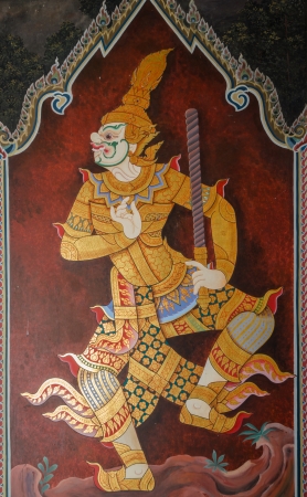 Traditional Thai painting art about Ramayana story on display at the temple wall Wat Prakaewの写真素材