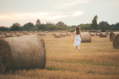 Girl Running in the Fieldの写真素材