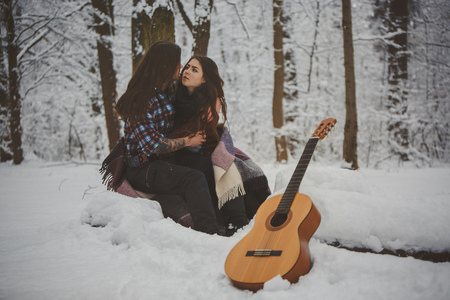 Man plays guitar to his girlfriendの写真素材