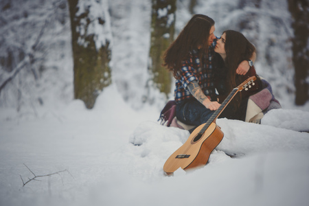 Man plays guitar to his girlfriendの写真素材