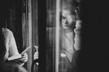 Beautiful girl reads a bookの写真素材