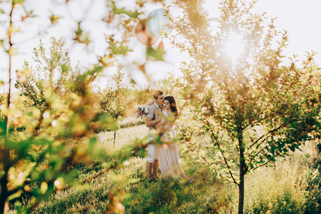 Man giving his wife, both having fun and the loving couple kissingの写真素材