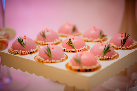 Birthday cookies - detail of a dessert table. Colorful cookies with pink birthday topperの写真素材