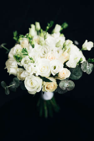 Wedding flowers, bridal bouquet close-up. Decoration of roses, peonies and ornamental plantsの写真素材