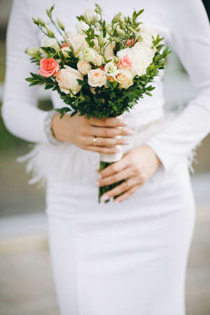 Wedding bouquet in the hands of the bride.の写真素材