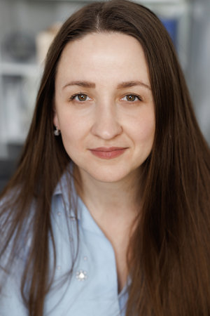 Portrait of confident young woman renter in modern own new apartment or house. Serious female woman looking at the camera.の写真素材