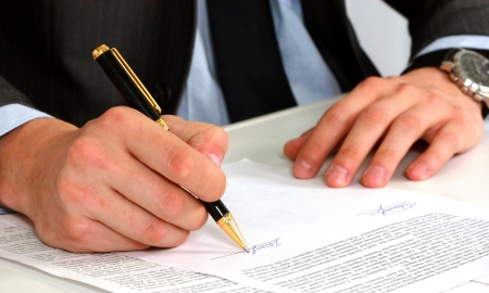 businessman sitting with documents sign up contract