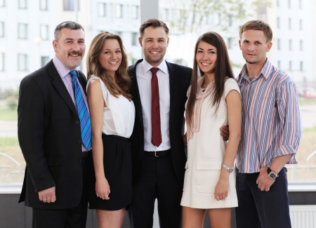 Closeup portrait of a successful business team laughing togetherの写真素材