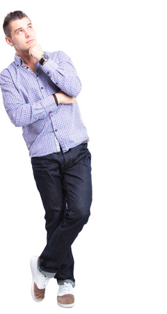 Thinking man isolated on white background  Closeup portrait of a casual young pensive businessman looking up at copyspace  Caucasian male model  の写真素材