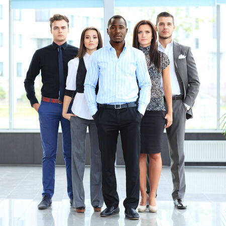Group portrait of a professional business team looking confidently at camera
