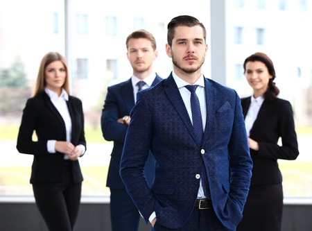 Businessman with colleagues in the background