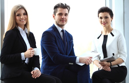 Happy smiling business team in officeの写真素材