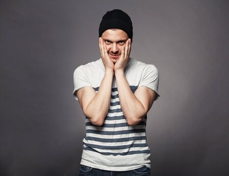 Portrait of young handsome man in t-shirt.の写真素材