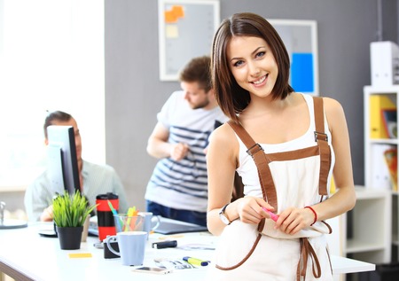 Image of four successful businesswomen looking at camera at meetingの写真素材
