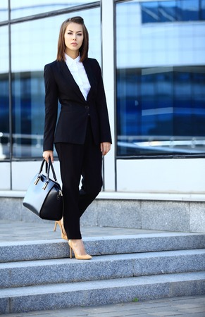 Portrait of a successful business woman smiling. Beautiful young female executive in an urban settingの写真素材