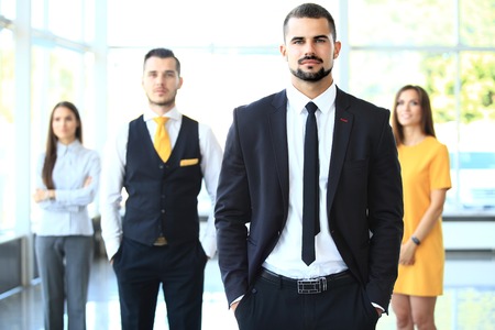 Group portrait of a professional business team looking confidently at cameraの写真素材