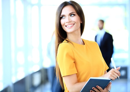 business woman with her staff, people group in background at modern bright office indoors