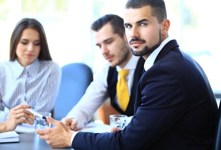 Happy young businessman in business meeting at office