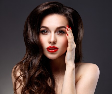 Beauty Model Woman with Long Brown Wavy Hair.の写真素材