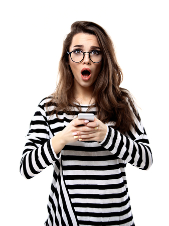 Surprised happy young woman. Isolated over white backgroundの写真素材