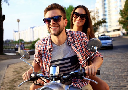 Couple in love riding a motorbike