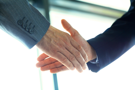 Business people shaking hands, finishing up a meetingの写真素材