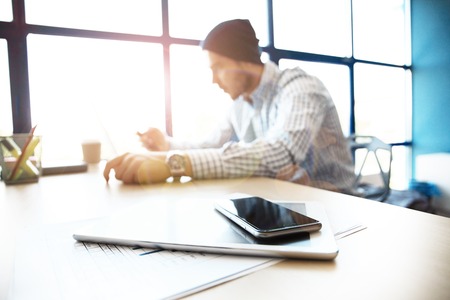 Office workplace with laptop on wood table against the windows.の写真素材