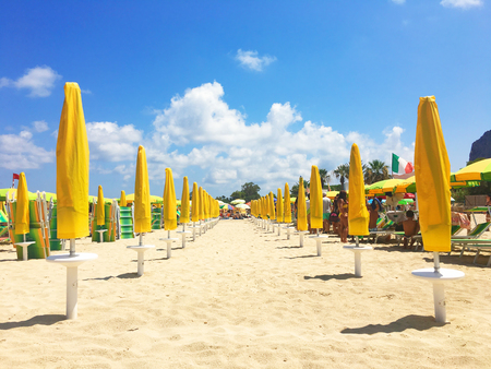 colorful sunshades in the beach on a sunny summer dayの写真素材